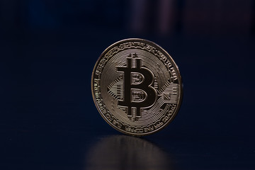 Golden bitcoin on black background. Bitcoin cryptocurrency.