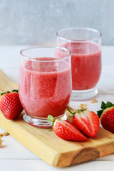 Strawberry smoothie and fresh fruits.