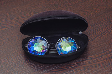 Designer glasses with kaleidoscope lenses in a black protective case