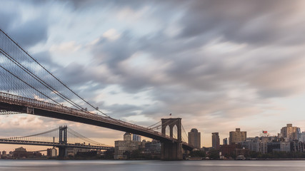 Brooklyn and Manhattan bridge over East River  with skyline of Brooklyn, viewed from Manhattan, New York, USA