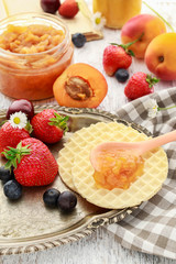 Tasty and healthy breakfast: waffles with fruit jam.