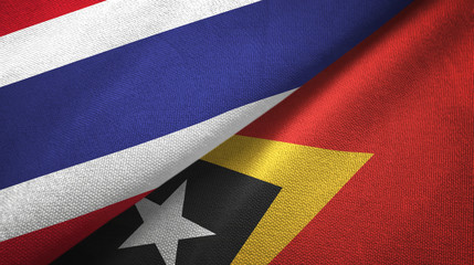 Fototapeta premium Thailand and Timor-Leste East Timor two flags textile cloth, fabric texture