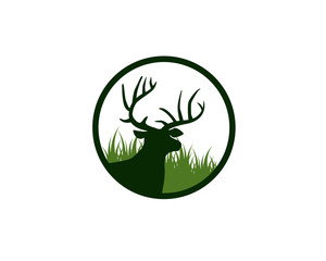 dear head with antlers in front of meadow grass inside circle logo