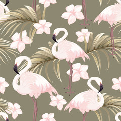 Seamless pattern with pink flamingos and tropical flowers
