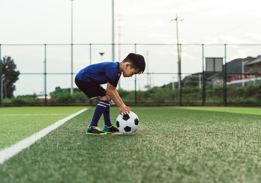 Boy playing soccer