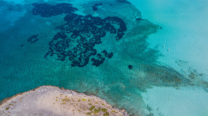 Fototapeta na wymiar Amazing drone aerial landscape of the charming beach Es Trencs. It has earned the reputation of Caribbean beach of Mallorca. Spain