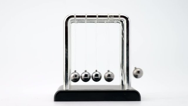 4k shot of Newton's metal balls on white background.