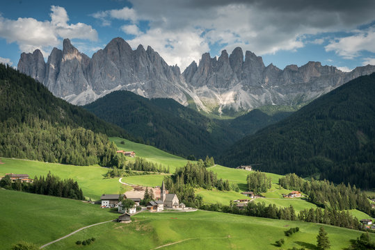Santa Magdalena church paints a fairytale picture.  Dolomites. Italy