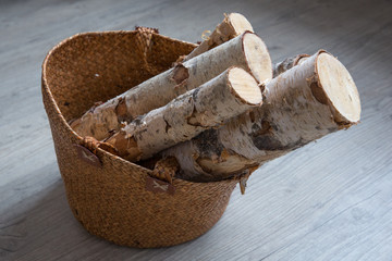 birch firewood in a basket