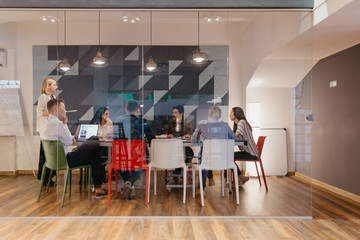 Group of people having a meeting in the modern office