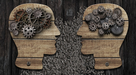Wooden heads with gears. Communication concept.