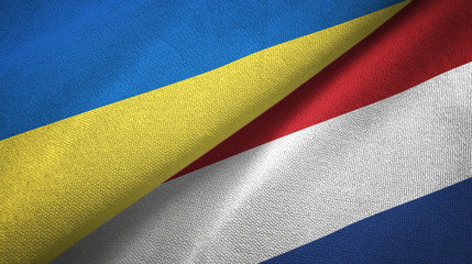 Ukraine and Netherlands two flags textile cloth, fabric texture