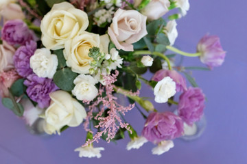 Obraz na płótnie Canvas Beautiful wedding flowers composition on a lilac background