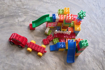 Colorful plastic toys for children to create an amusement park and an imaginary city.