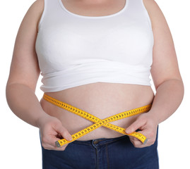 Overweight woman measuring waist with tape isolated on white, closeup