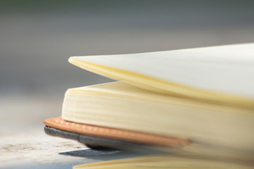 book in outdoor, close-up book blur background