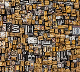 Dusty old metal letterpress type pieces background
