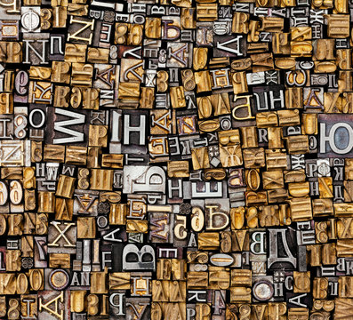 Dusty Old Metal Letterpress Type Pieces Background