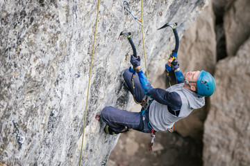 Climbing man on a rock.