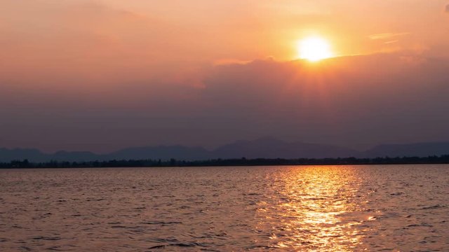 Time lapse nature background. Sunset time interval. The movement of clouds and Sun.