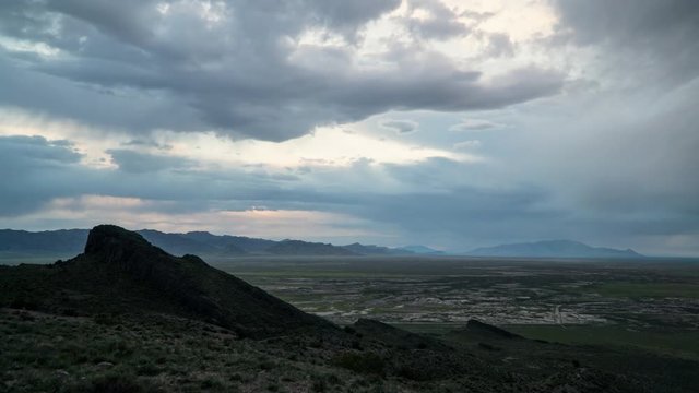 Time lapse of clouds moving over the West Desert in Utah at dusk from Table Mountain.