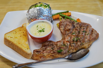 Pork chops steak with mashed potatoes, boiled vegetables