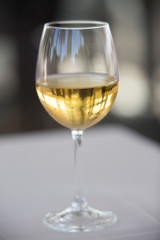 Glass of White wine with glowing golden color