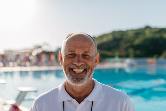Swimming coach smiling