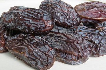 Sweet dried date fruit on white background, closeup