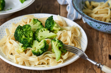 Noodles with boiled broccoli on a plate