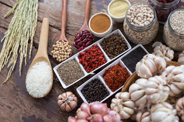 Cereal grains , seeds, beans,spices on wooden background.