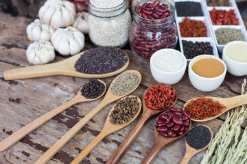 Cereal grains , seeds, beans,spices on wooden background.