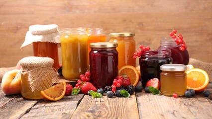 selection of jam on wood background