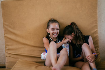 Gymnastic Happy Young Girls Sitting