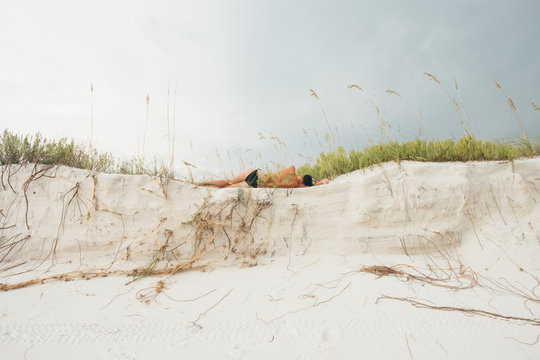 Woman laying in the dunes