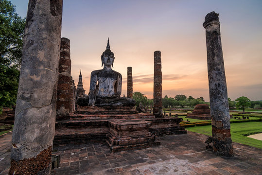 Ancient Buddhist temple in Sukhothai at sunrise, Thailand