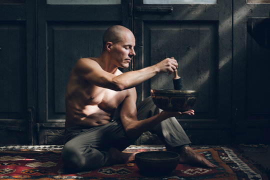 Man using spiritual items for yoga