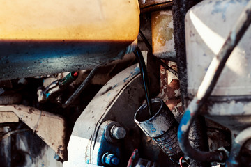 Tractor maintenance. Filling engine oil.