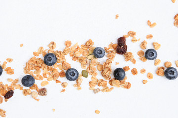 Crunchy muesli and blueberry Breakfast cereals isolated on white background, selective focus, top view