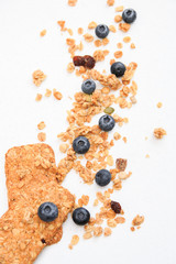 Crispy muesli cookies and blueberry Breakfast cereals isolated on white background, selective focus, top view