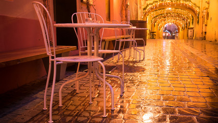 street cafe at the night against city illumination lights