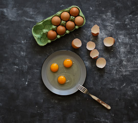 Chicken eggs on black background