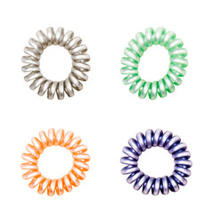 Colorful Hair Band Isolated on White Background with Clipping Path. Closeup of Spiral Four Colorful Rubber Bands for Fashion Accessories. Beautiful Elastic Hair Ties for Hairstyle, Copy Space.