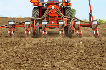 Tractor with mounted crop seeder