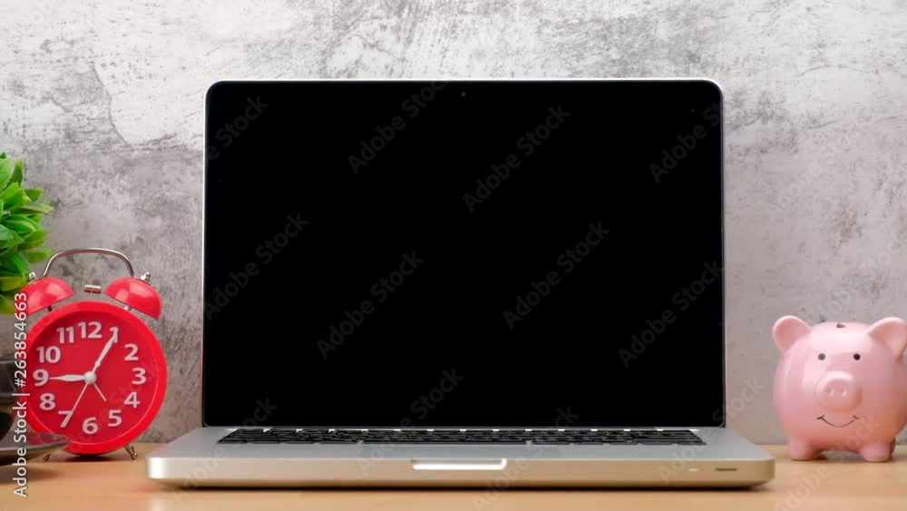 Poster modern laptop computer with empty screen on office desk table.zoom out shot 4k resolution