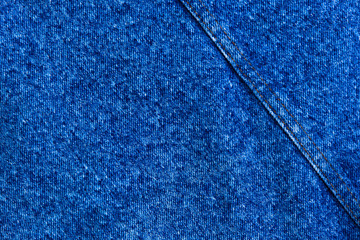 classic grunge background: real old american denim, close, scar and thread, short focus, top view