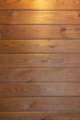 grunge background: plank surface, varnished boards, yellow lights on top