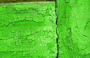 Obraz premium Old wooden background with remains of pieces of scraps of old paint on wood. Texture of an old tree, vintage wood background peeling paint. old blue board with cracked paint