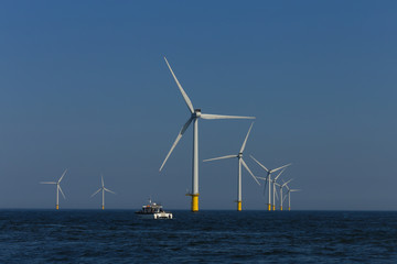 view of windmills of Rampion windfarm off the coast of Brighton, Sussex, UK