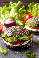 Vegetarian Burger with cottage cheese cream and vegetables.